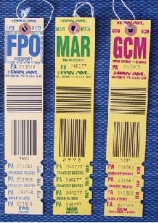 A group of three Pan Am baggage labels from the 1985-90 time period.  Destinations listed left to right are Freeport, Bahamas, Maricaibo, Venezuela and Grand Cayman, Cayman Islands